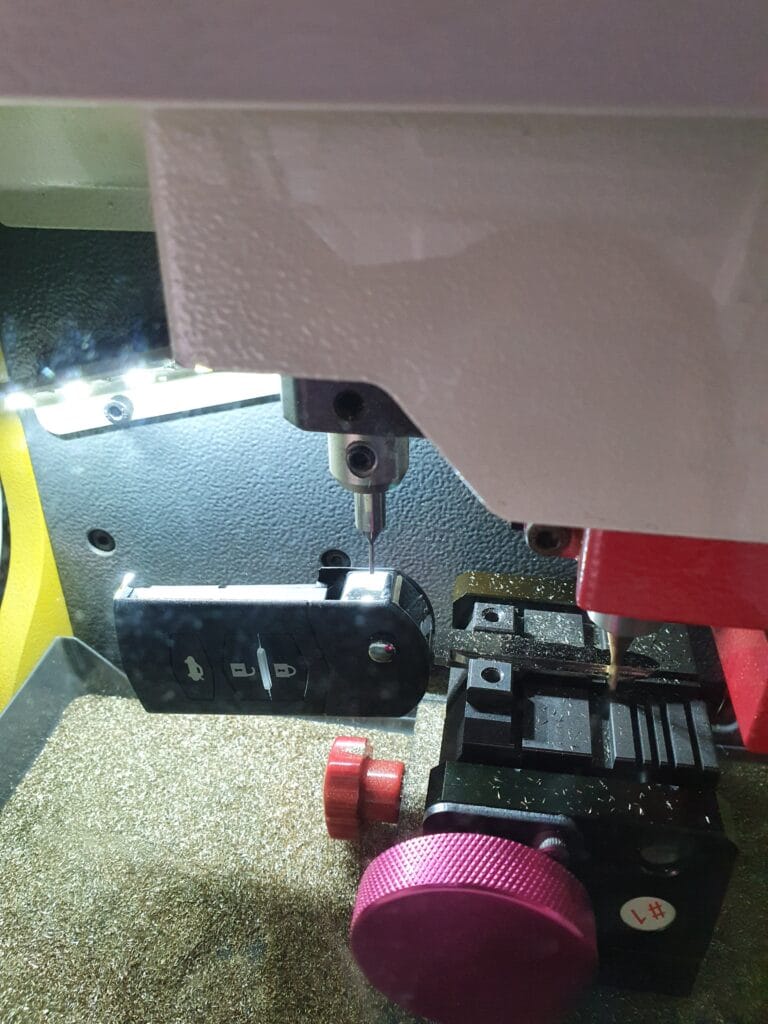 Mazda flip key being cut on-site by All Star Lock & Key