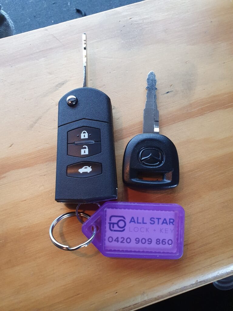 New Mazda flip key cut and programmed by All Star Lock & Key