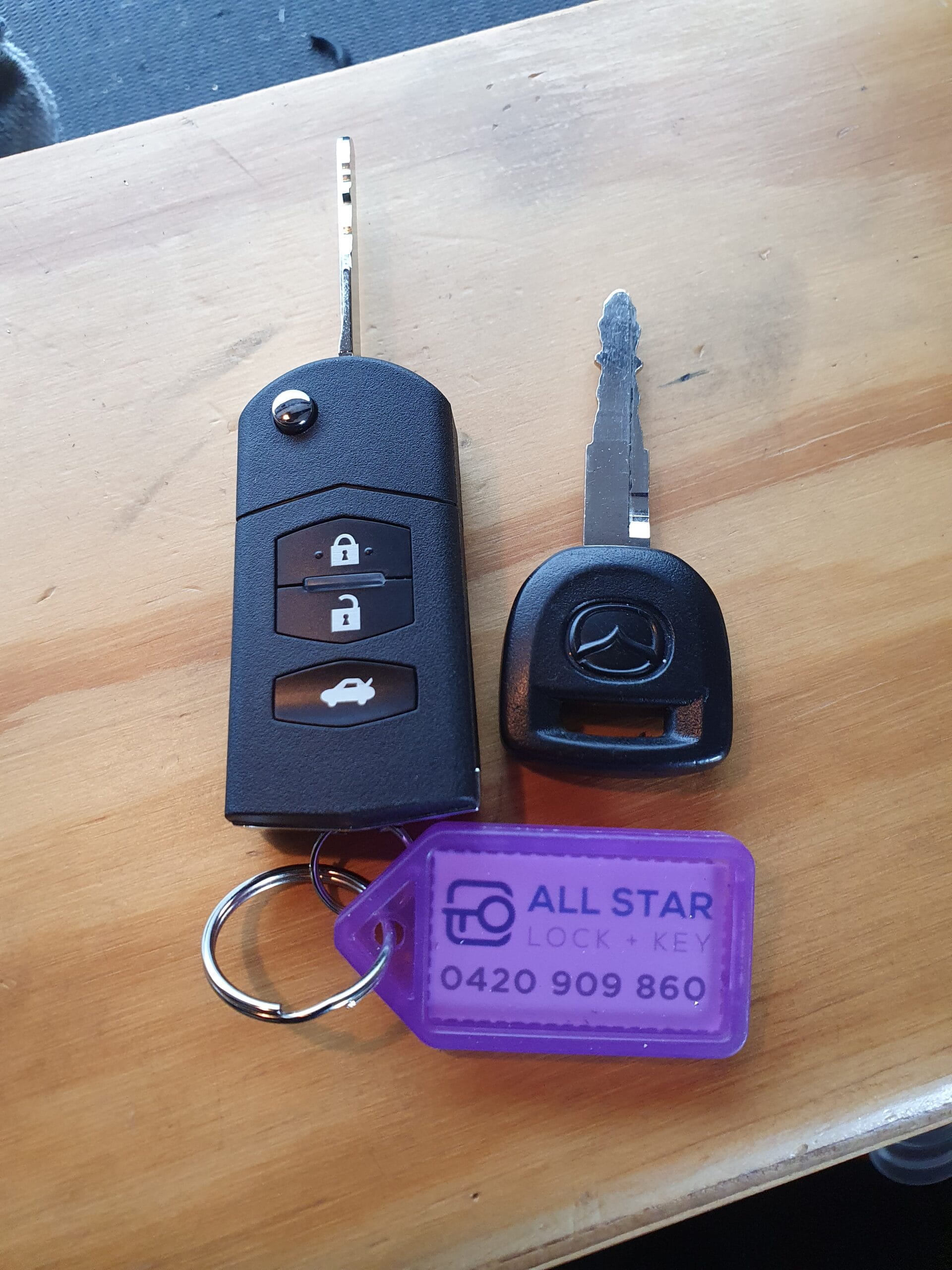 New Mazda flip key cut and programmed — All Star Lock & Key